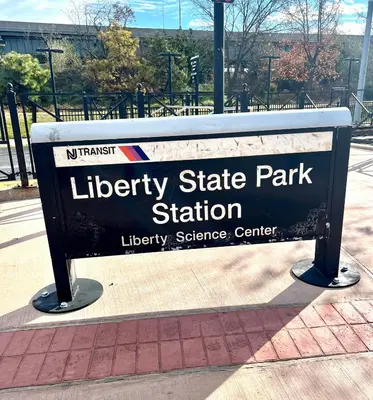 a sign for a library state park station at Studio Apartment with Garden Jersey City in Jersey City