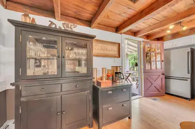 a large gray cabinet in a kitchen with a door at A perfect couples fall getaway in Hawley