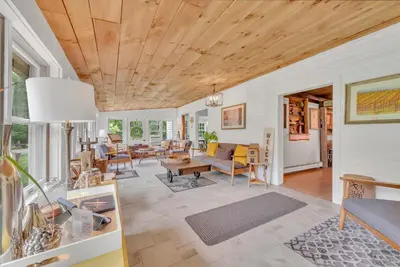 a living room with a couch and a table at A perfect couples fall getaway in Hawley