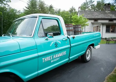 a blue truck is parked in a driveway at A perfect couples fall getaway in Hawley