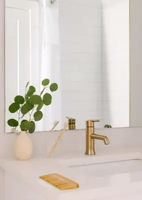 a bathroom counter with a sink and a mirror at Sosuite at The Ovation - Ave of The Arts in Philadelphia