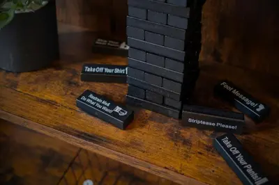 a wooden table with four black bricks on it at Cozy Desert Den 10 Min Downtown& 6 Min Brewerytown in Philadelphia