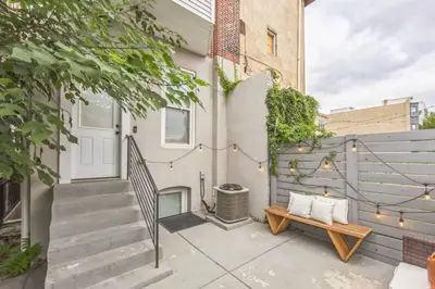 a patio with a bench and a fence at Large Bi-Level 3BR w Patio - 10 min to DT in Philadelphia