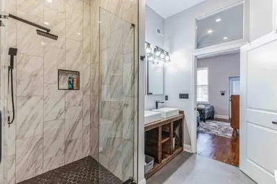 a bathroom with a shower and a sink at Large Bi-Level 3BR w Patio - 10 min to DT in Philadelphia