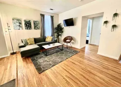 a living room with a couch and a table at Incredible Location - Large Center City 2 BR in Philadelphia