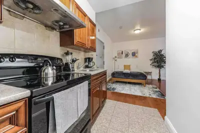 a kitchen with a stove and a sink at Cozy Studio across from Convention Center - 4R in Philadelphia