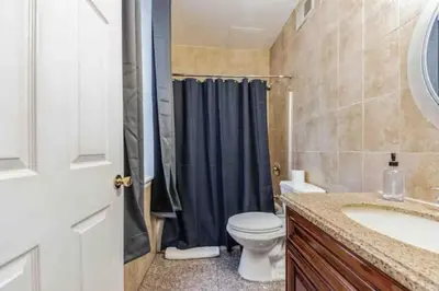 a bathroom with a toilet and a sink and a shower at Cozy Studio across from Convention Center - 4R in Philadelphia