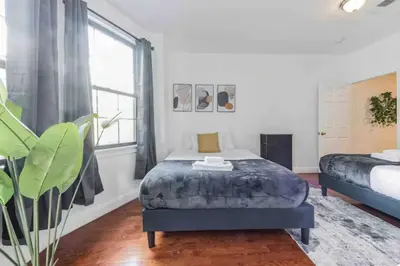 a bedroom with a bed and a large window at Across from Convention Center 4F - Sleeps 6 - 4F in Philadelphia
