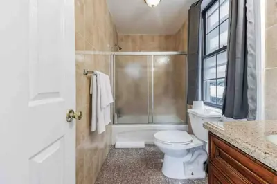 a bathroom with a shower and a toilet and a sink at Across from Convention Center - Sleeps 6 - 3F in Philadelphia