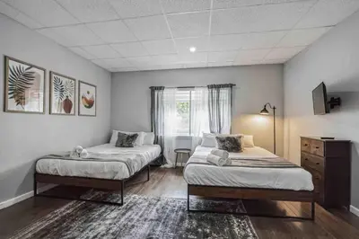 a bedroom with two beds and a window at BRAND NEW Modern 2BR - Heart of Center City in Philadelphia