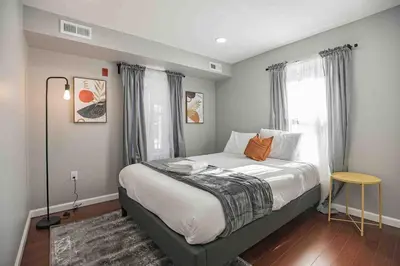 a bedroom with a bed and a window at Modern and Stylish Center City 1BR - Perfect Location in Philadelphia