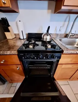 a stove in a kitchen with a tea kettle on it at Prime Location Studio in Center City with Fast Wifi in Philadelphia