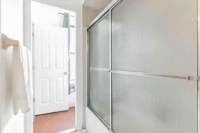 a shower with a glass door in a bathroom at Spring Garden Small and Cozy Studio Sleeps 4 in Philadelphia