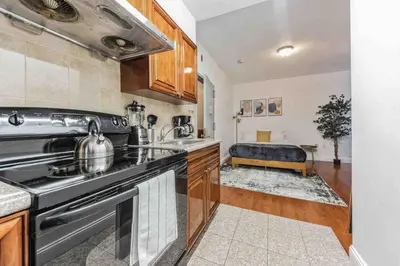 a kitchen with a stove and a sink at Cozy Studio Across from Convention Center - 3R in Philadelphia