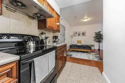 a kitchen with a stove and a sink at Cozy Studio Across from Convention Center - 3R in Philadelphia