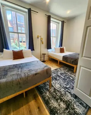 two beds in a room with two windows at Renovated Jr 1BR - Center City - Sleeps 4 - 2 Beds in Philadelphia