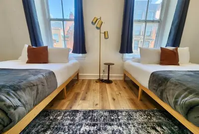 two beds in a room with two windows at Renovated Jr 1BR - Center City - Sleeps 4 - 2 Beds in Philadelphia