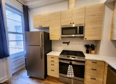 a kitchen with a stainless steel stove and a microwave at Renovated Jr 1BR - Center City - Sleeps 4 - 2 Beds in Philadelphia