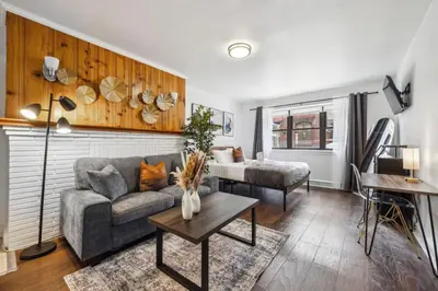 a living room with a couch and a table at Charming Studio in the Heart of Center City with Fast WiFi in Philadelphia