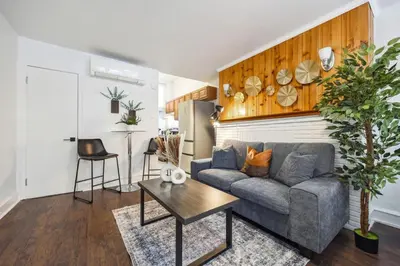a living room with a couch and a table at Charming Studio in the Heart of Center City with Fast WiFi in Philadelphia