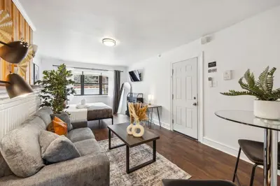 a living room with a couch and a table at Charming Studio in the Heart of Center City with Fast WiFi in Philadelphia