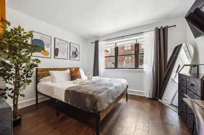 a bedroom with a bed and a window at Charming Studio in the Heart of Center City with Fast WiFi in Philadelphia