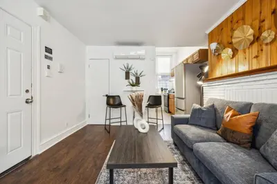 a living room with a couch and a table at Charming Studio in the Heart of Center City with Fast WiFi in Philadelphia
