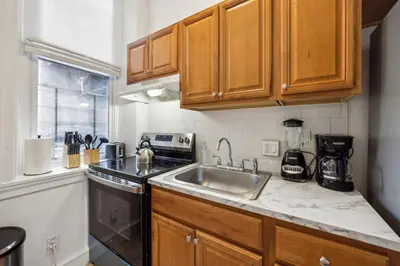 a kitchen with a sink and a counter top at Charming Studio in the Heart of Center City with Fast WiFi in Philadelphia