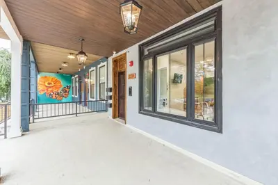 an empty hallway of a building with windows at New 2BR Across from Fairmount Park - 10 mins to DT in Philadelphia