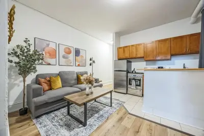 a living room with a couch and a table at Quaint and Cozy Center City 1BR that Sleeps 4 in Philadelphia