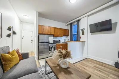 a living room with a couch and a table at Quaint and Cozy Center City 1BR that Sleeps 4 in Philadelphia