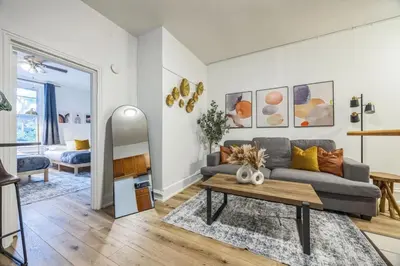 a living room with a couch and a table at Quaint and Cozy Center City 1BR that Sleeps 4 in Philadelphia