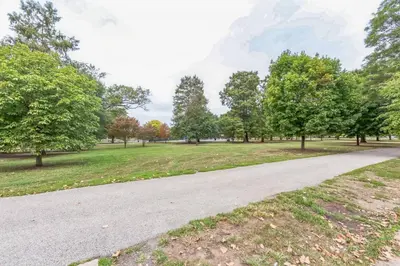 a road in a park with trees and grass at Bi-Level 2BR w Rooftop - Sleeps 12 - 10 min to DT in Philadelphia