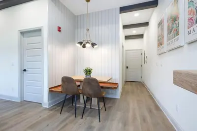 a dining room with a table and two chairs at 1BR Across from Fairmount Park - 10 mins to DT (E) in Philadelphia
