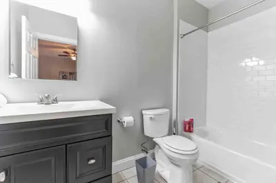 a bathroom with a toilet and a sink and a shower at NEW 4 Bedroom - 4 Bathroom Center City with Private Rooftop Terrace Sleeps 20) in Philadelphia
