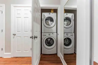 three washing machines are in a laundry room at NEW 4 Bedroom - 4 Bathroom Center City with Private Rooftop Terrace Sleeps 20) in Philadelphia