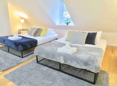 a bedroom with two beds and a window at In the heart of Center City - Large bi-level 3BR in Philadelphia