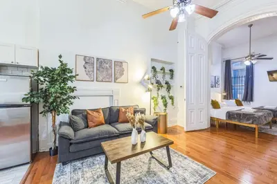 a living room with a couch and a table at Large Historical Center City 1BR that Sleeps 4 in Philadelphia