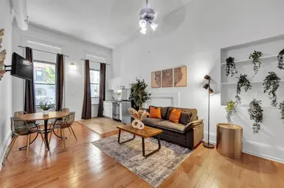 a living room with a couch and a table at Large Historical Center City 1BR that Sleeps 4 in Philadelphia