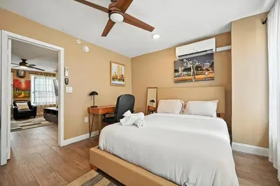 a bedroom with a large bed and a desk at Charming Home in Vibrant Philadelphia in Philadelphia