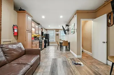 a living room with a couch and a table at Charming Home in Vibrant Philadelphia in Philadelphia
