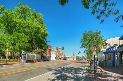an empty city street with a bike parked at a traffic light at Charming Home in Vibrant Philadelphia in Philadelphia