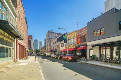 a city street with cars parked on the side of the road at Charming Home in Vibrant Philadelphia in Philadelphia