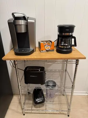 a table with a coffee maker and a coffeemaker on it at Cozy Comfy with AMAZING NYC Views 15min to Manhattan T SQ in Union City
