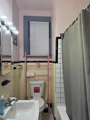 a bathroom with a toilet and a sink and a shower at Cozy Comfy with AMAZING NYC Views 15min to Manhattan T SQ in Union City