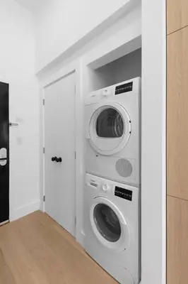 a laundry room with a washer and dryer at 19-5D 2BR 2Baths Luxury Apt East Village in New York