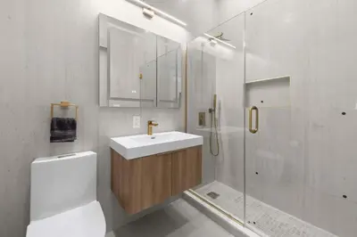 a white bathroom with a sink and a shower at 19-5D 2BR 2Baths Luxury Apt East Village in New York