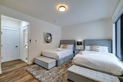 a bedroom with two beds and a couch at The Perfect Pocono Escape in Pocono Farms East