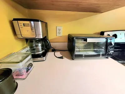 a toaster oven sitting on top of a kitchen counter at Shawnee Ski Mountain View Jacuzzi Townhouse in East Stroudsburg
