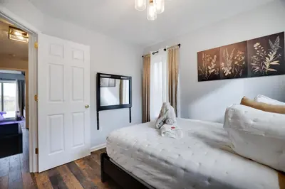 a bedroom with a bed with a stuffed animal on it at Mountain Chalet Ski, Hike, & Explore in Tannersville
